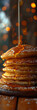 Thick pancakes with golden syrup pouring from above. Vertical banner 1:3