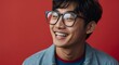 Portrait of attractive handsome nerdy korean guy optimistic happy laughing on plain bright black background from Generative AI