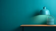© Janina - A modern minimalist blue lamp with a shadow on a teal background, placed on a wooden shelf, creating a serene atmosphere, product presentations