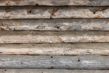 Wall Mural - Wooden wall made of old logs, frontal background texture