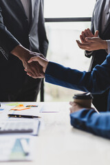 Wall Mural - Business people shaking hands in business partnership meeting.