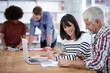 © Mikolette Moller/peopleimages.com - Business people, discussion and laptop in office with colleagues, teamwork and document for working. Collaboration, professionals and brainstorming for project or career in meeting or workplace