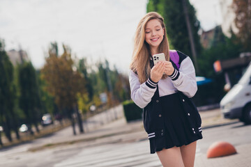 Sticker - Photo portrait of lovely teenager lady schoolgirl hold telephone wear trendy uniform garment autumn park sunny day background