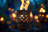 Fototapeta  - Burning Candle in Front of Blurred Background