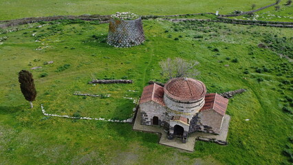 Nuraghe Santa Sabina in Silanus in central Sardinia with the church of Santa Serbana next to it.