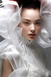 © Sandra Chia - Fashion Surreal Concept. Closeup portrait of pretty woman in avant garde ethereal futuristic swirl edgy headgear outfit. illuminated dynamic composition.. copy space