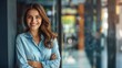 Happy stylish female woman wearing blue shirt standing arms crossed on blur background. AI generated