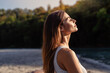 © Tetiana Soares - Young woman with long hair enjoying sun with closed eyes getting natural vitamin D outdoors. Peace of mind. Mindfulness, mental health,  spirituality, well-being, unwind yourself