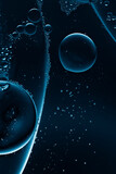 Fototapeta Las - bubbles in clear liquid, dark science background