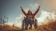 Young disabled woman in a wheelchair with raised hands in the countryside. Concept of people with disabilities