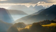 Foggy Misty Sunrise In The Mountain Valley With Rays Of Light