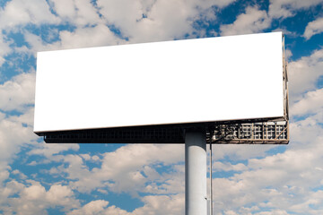 Wall Mural - blank wide horizontal white billboard mockup or large display against the blue sky with white clouds