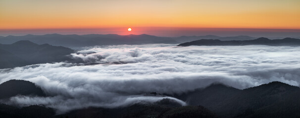 Wall Mural - Foggy morning. Panorama with sunrise. Landscape with high mountains. Touristic place Carpathian national park, Ukraine Europe. Natural scenery.