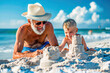 Grandson and grandfather enjoying a day at the beach building sand castles