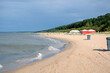 Empty long sandy beach on Baltic Sea in Riga suburban in Jurmala in overcast day in low season