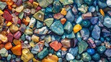 Fototapeta Przestrzenne - Close-up view of multicolored polished gemstones showing a rich texture and variety of patterns.