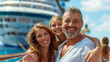 © tiagozr - Happy family embarking on a cruise. Smiling with a cruise ship in the background.