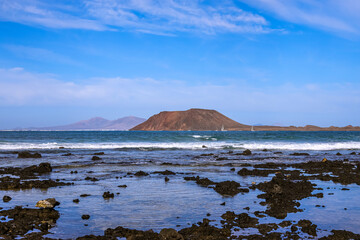 Wall Mural - The scenic view of Lobos Island. Lobos is a small island of the Canary Islands located north of the island of Fuerteventura.	