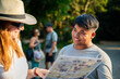 © ADDICTIVE STOCK - Smiling tourists with map exploring new city