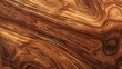 The image is a close-up of a wooden surface with a beautiful grain pattern. The wood is a rich, dark brown color with light brown streaks.