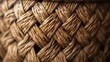 This is a close-up image of a wicker basket. The basket has a natural brown color and is made of tightly woven twigs.