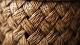 Fototapeta Zachód słońca - This is a close-up image of a wicker basket. The basket has a natural brown color and is made of tightly woven twigs.