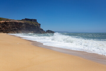 Sticker - North Beach famous for giant waves in Nazare town on so called Silver Coast, Oeste region of Portugal, view with fort of Saint Michael the Archangel