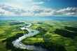 Aerial view of green agricultural field and river in the morning.