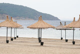 Fototapeta  - Sunbeds, Umbrellas and Hammocks in a beach