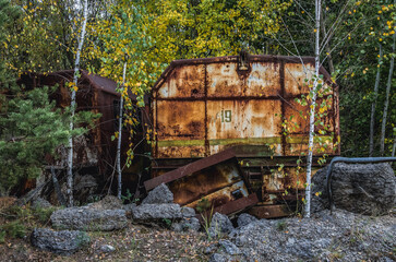 Canvas Print - Old wagon near Unfinished cooling tower of reactor 5 of Chernobyl Nuclear Power Plant in Chernobyl Exclusion Zone, Ukraine