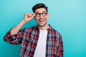 Sticker - Photo of smart excited man dressed plaid shirt arms eyewear looking empty space isolated turquoise color background