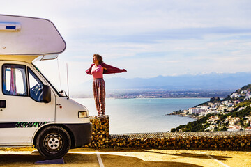 Canvas Print - Woman enjoy caravan vacation.