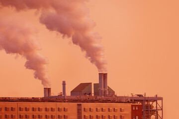 dramatic view factory with steam coming out of chimney, rising into sunset sky, captures power and industry, environmental impact of industrialization, sustainable practices of modern world