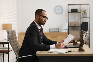 Sticker - Confident lawyer working with document at table in office