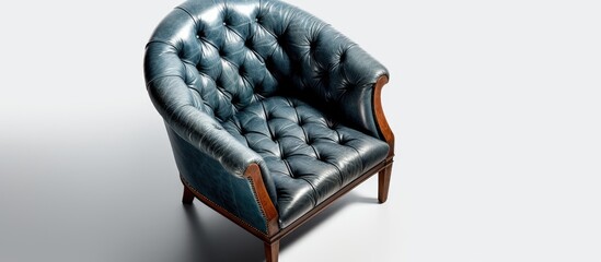 Canvas Print - A stylish blue leather chair with wooden legs and armrests is placed on a white rectangular surface. The chair features a unique pattern and provides comfort