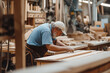 Skilled Carpenter Measuring Wooden Plank in a Dusty Workshop