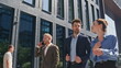 © stockbusters - Office coworkers strolling street smiling enjoying communication. People talking