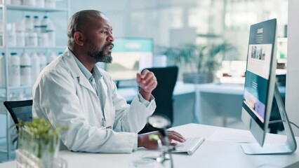 Science, healthcare and black man on computer in laboratory for research, website and internet. Pharmaceutical, hospital and doctor on pc for medical innovation, data analysis and online report