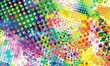 Vivid multicolored background featuring various sizes of circles and dots in a halftone pattern