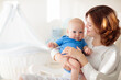 © famveldman - Happy young mother with baby boy at home