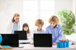 © famveldman - Online remote learning. School kids with computer.