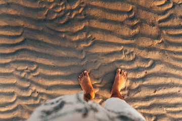 Wall Mural - Summer travel concept feet on beach sand