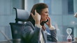 © stockbusters - Business girl complaining cellphone conversation dissatisfied work close up.