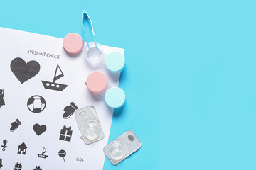 Sticker - Eye test chart with tweezers, containers and contact lenses on blue background