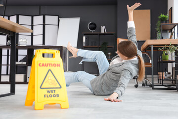 Poster - Traumatized young businesswoman fell down on wet floor in office