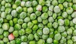 close up of frozen green peas, top view of vegetable food, peas from freezer background 