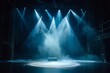 A stage with creative lighting for a modern dance production, featuring spotlights and other stage lights