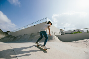 Wall Mural - Skateboarder skateboarding at skatepark in city