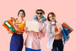 © Pixel-Shot - Business colleagues with folders and gadgets ready for summer vacation on pink background