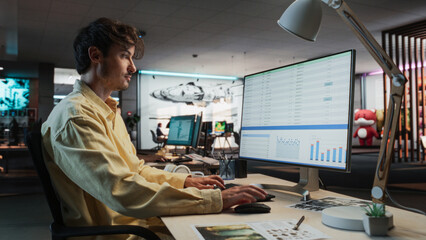 Aufkleber - Caucasian Male Manager Using Desktop Computer With Analytics Software wth Financial Reports. Man Working In Game Development Company Diverse Office